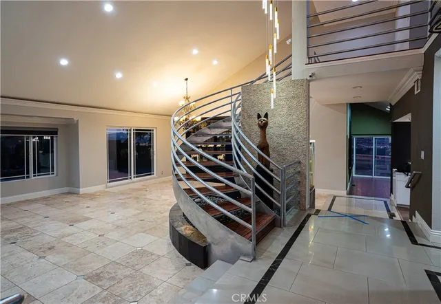 a spacious bathroom with a granite countertop sink mirror and shower