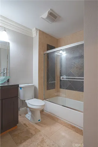 an empty room with wooden floor and closet