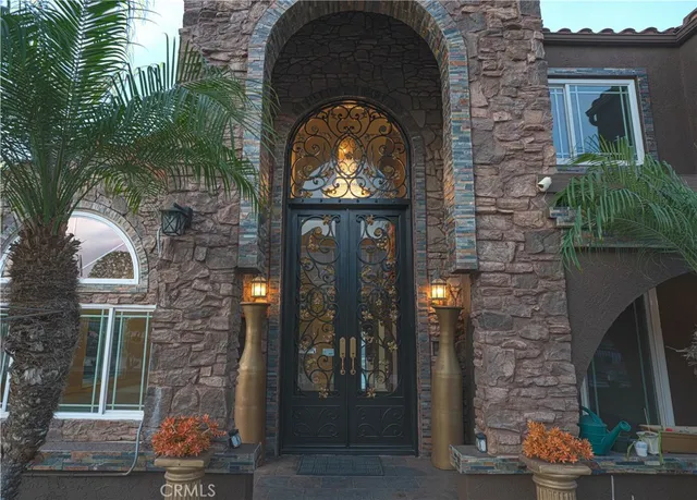 a view of a brick house with a small yard