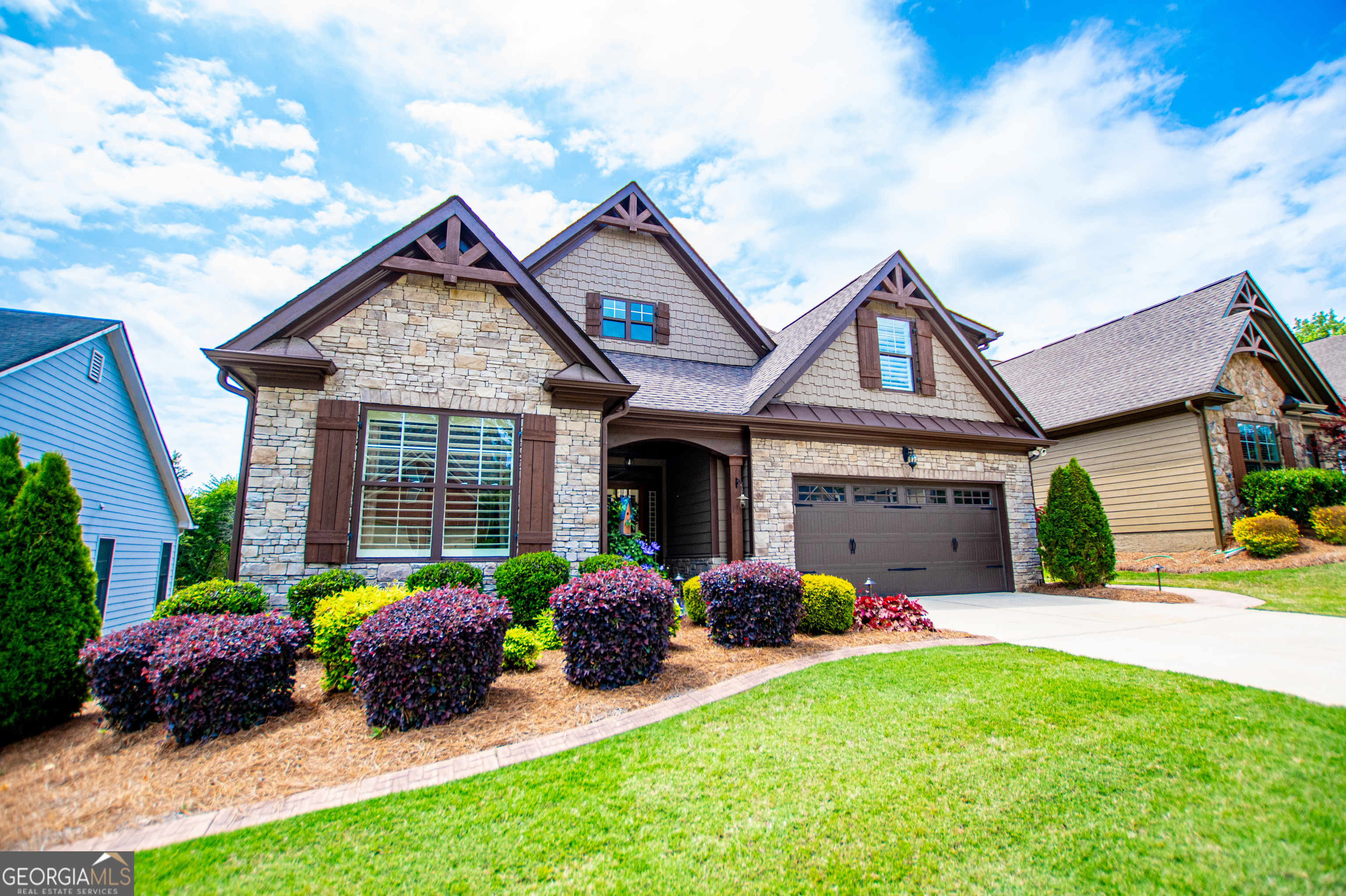 216 Yorkshire Lane Villa Rica, GA 30180 - Photo 6 of 94 a front view of a house with a garden and plants