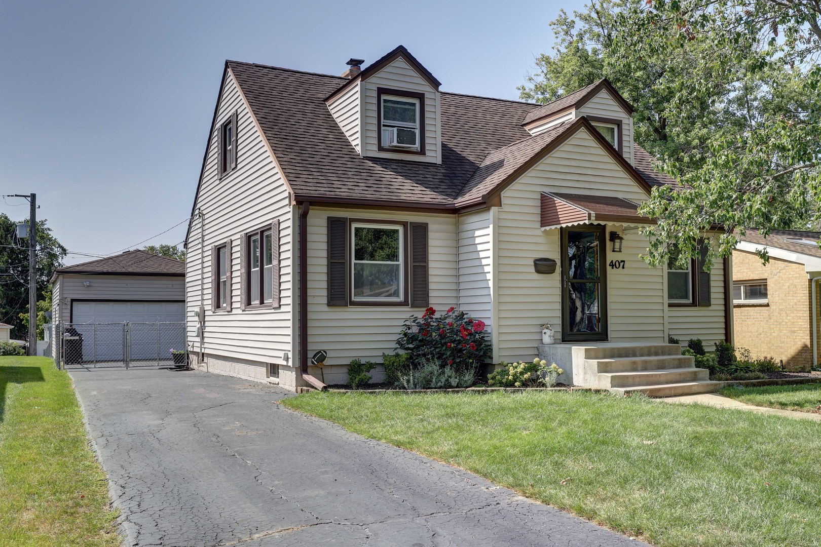 407 West Taylor Road Lombard, IL 60148 - Photo 1 of 33 a front view of a house with a yard