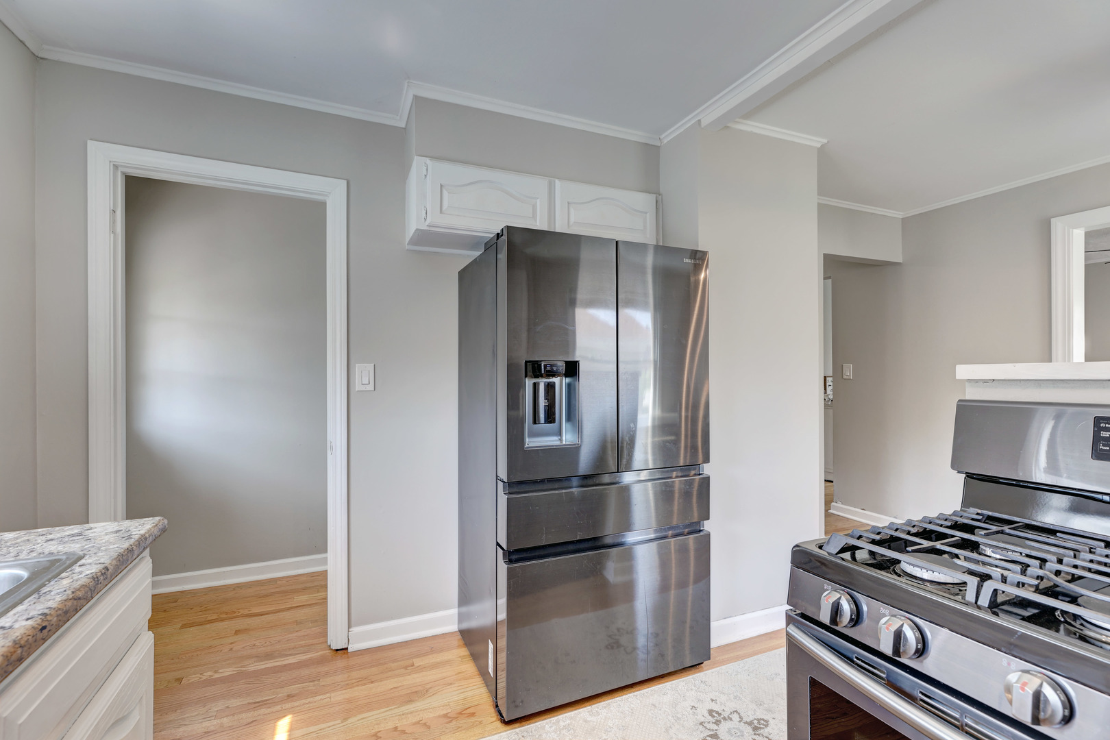 407 West Taylor Road Lombard, IL 60148 - Photo 12 of 33 a kitchen with stainless steel appliances granite countertop a refrigerator and a stove top oven
