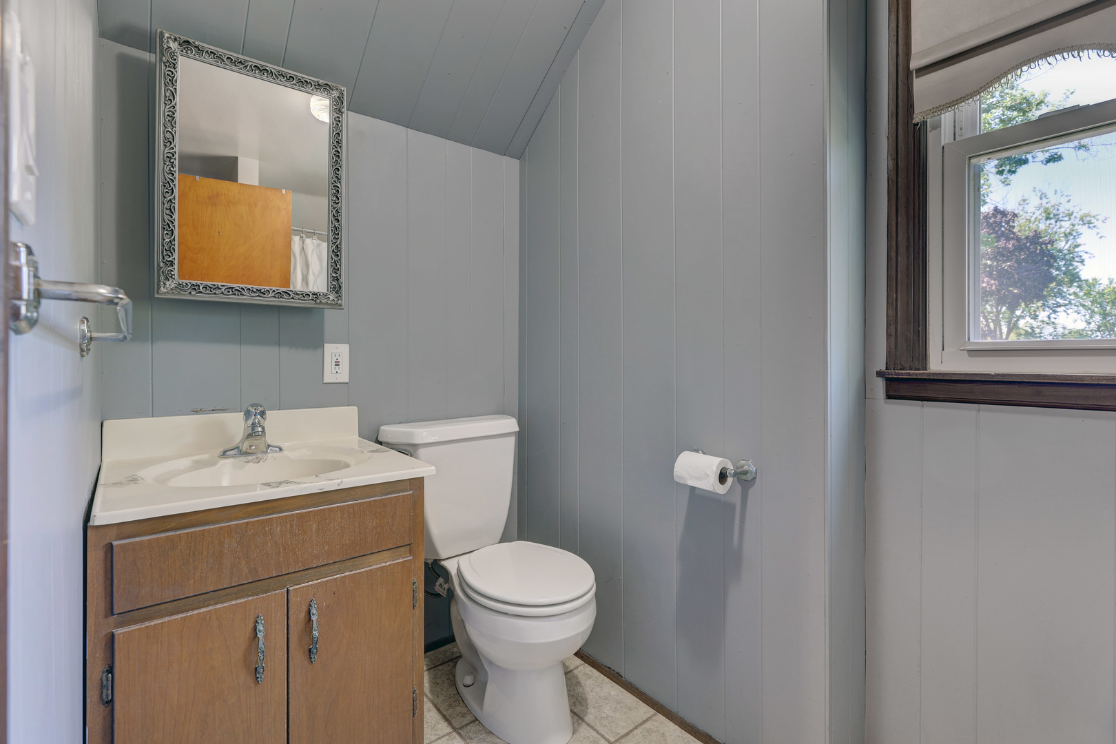 407 West Taylor Road Lombard, IL 60148 - Photo 20 of 33 a bathroom with a toilet sink vanity and mirror