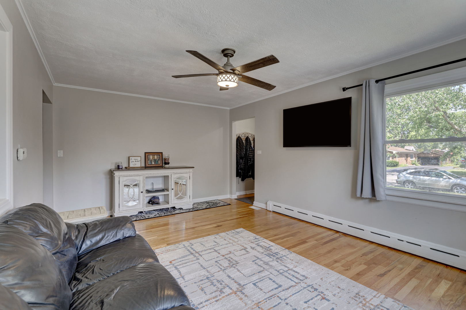 407 West Taylor Road Lombard, IL 60148 - Photo 8 of 33 a living room with furniture and a flat screen tv