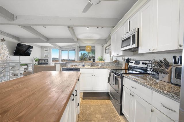 a living room with lots of furniture and a flat screen tv