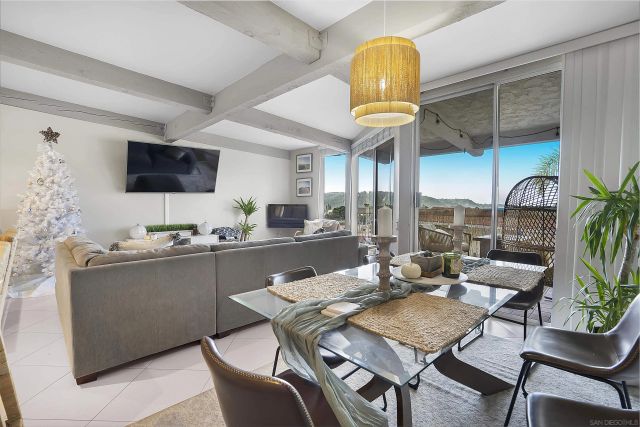 a large kitchen with a table and chairs