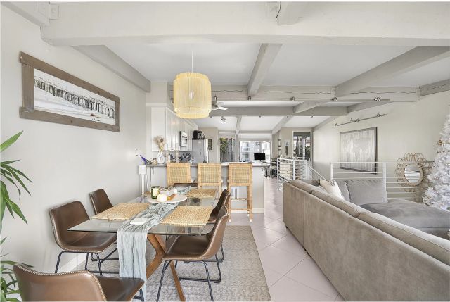 a balcony with furniture and a table