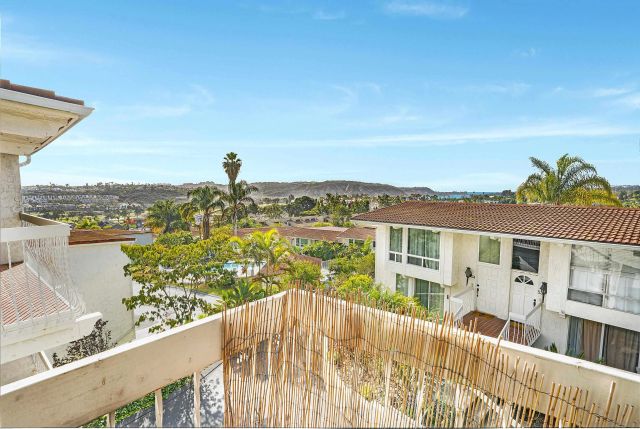 a spacious bedroom with a large bed and a large window