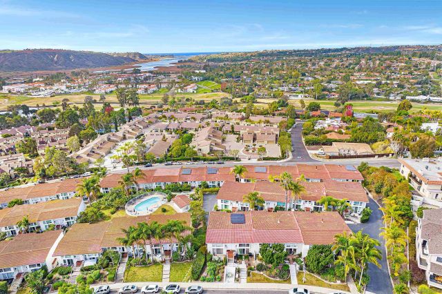 an aerial view of residential building and parking space