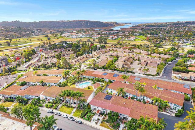 an aerial view of residential building with an outdoor space