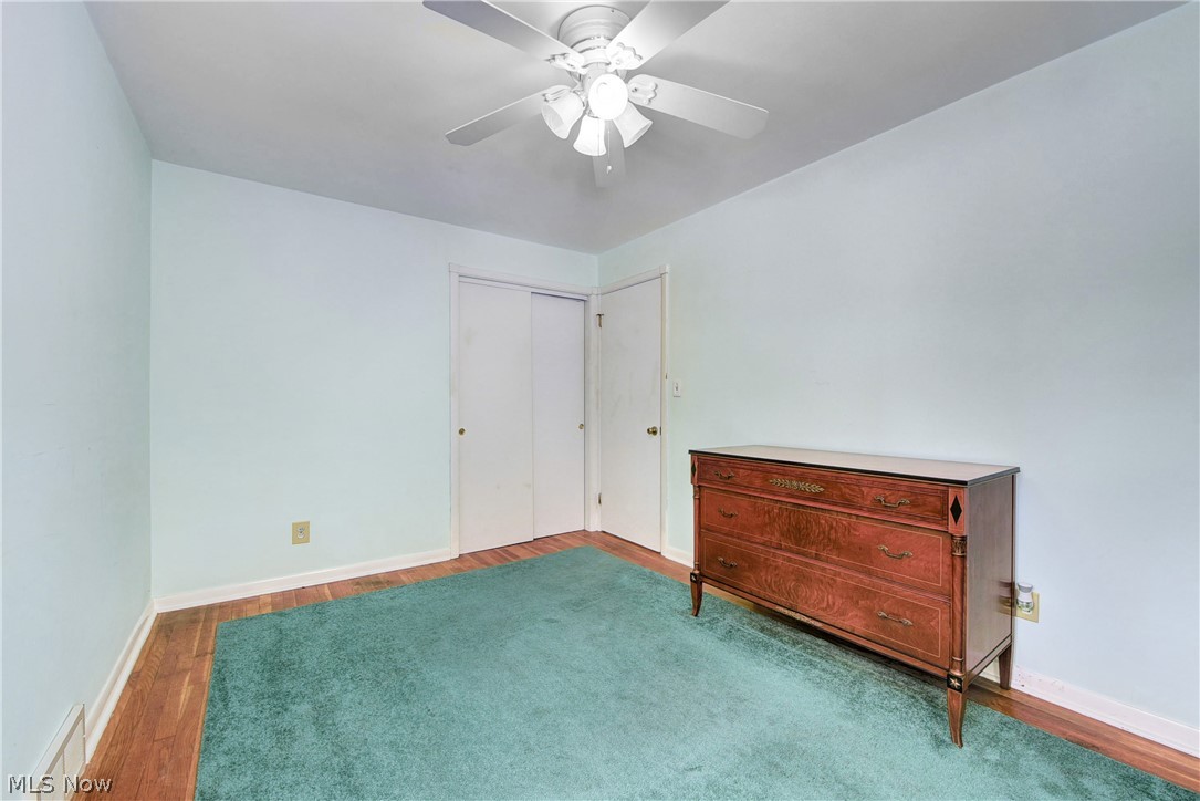 21399 Mastick Road Cleveland, OH 44126 - Photo 31 of 47 Unfurnished bedroom with hardwood / wood-style floors, a closet, and ceiling fan