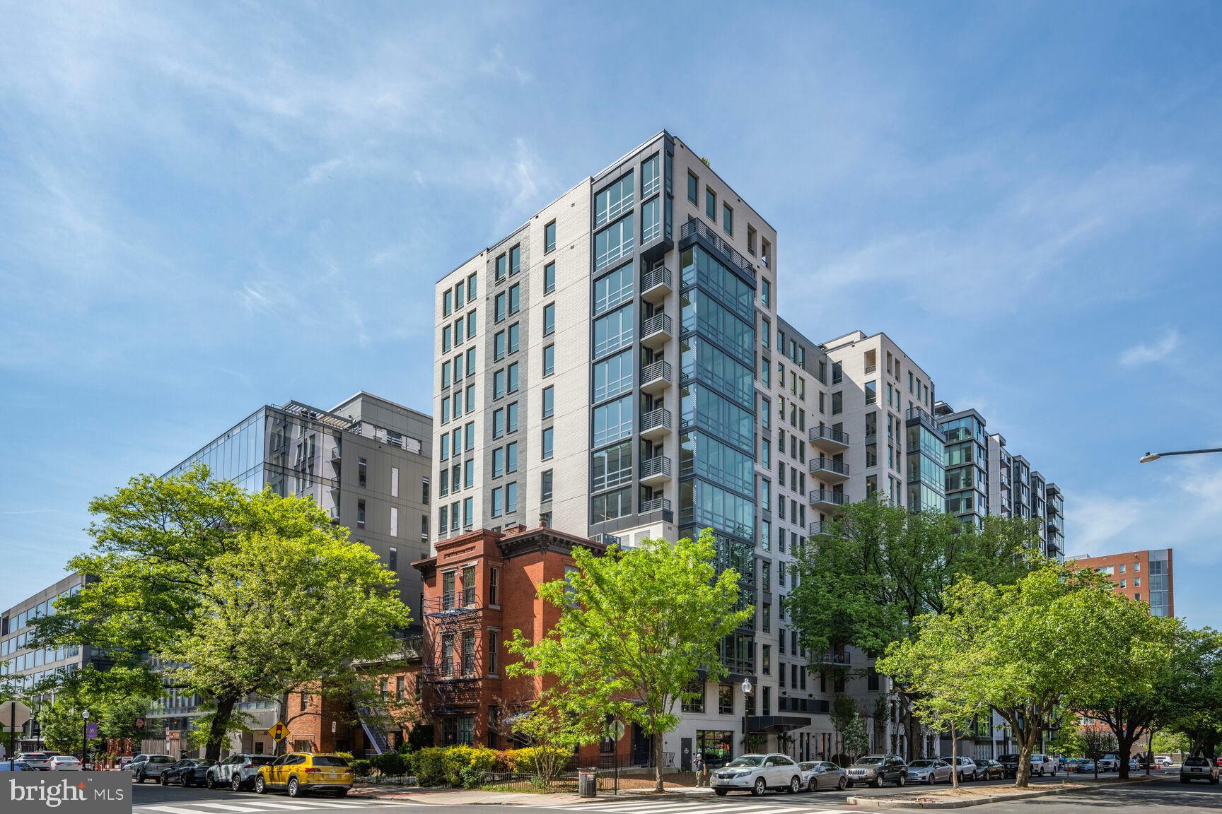 950 3rd Street Northwest, Unit 302 Washington, DC 20001 - Photo 1 of 36 a view of a tall building next to a road