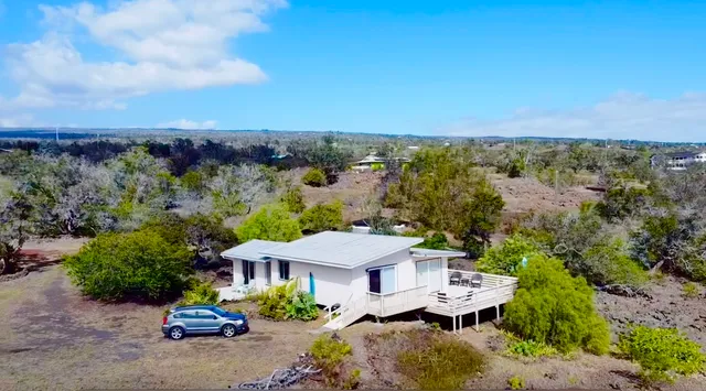 an aerial view of a house with a garden