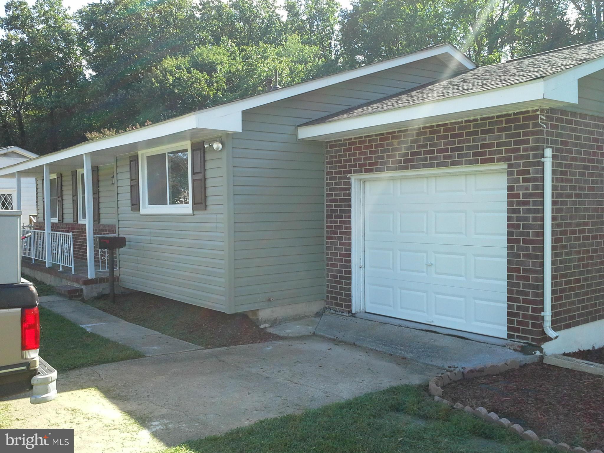 6217 Commons Road Baltimore, MD 21237 - Photo 3 of 30 One car garage with new door.