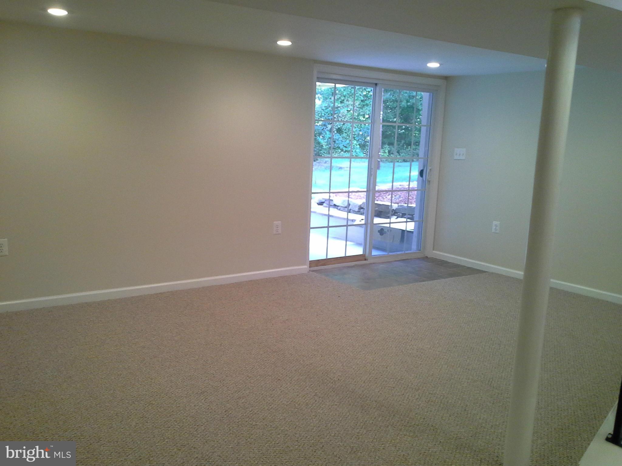 6217 Commons Road Baltimore, MD 21237 - Photo 22 of 30 A lot of space with sliders to the patio.