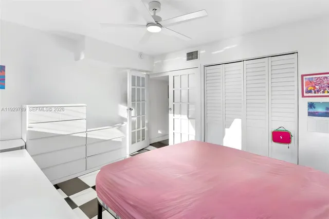 a bedroom with a bed and a closet