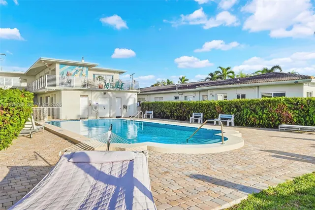 a view of a swimming pool and a chairs