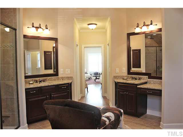 11826 Lowery Ridge Drive Raleigh, NC 27614 - Photo 14 of 25 Master bath with his and her vanity, large shower, and jacuzzi tub.