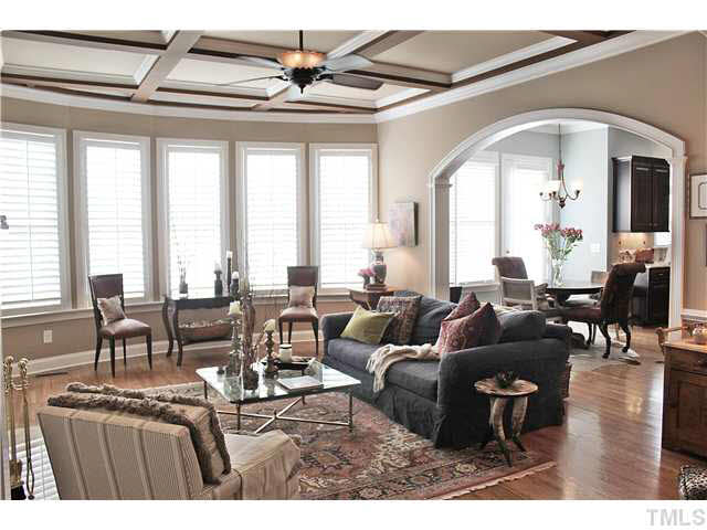 11826 Lowery Ridge Drive Raleigh, NC 27614 - Photo 6 of 25 What a beautiful room-coffered ceiling, hardwoods, bowed wall of windows, built in cabinetry, so many architectural details.