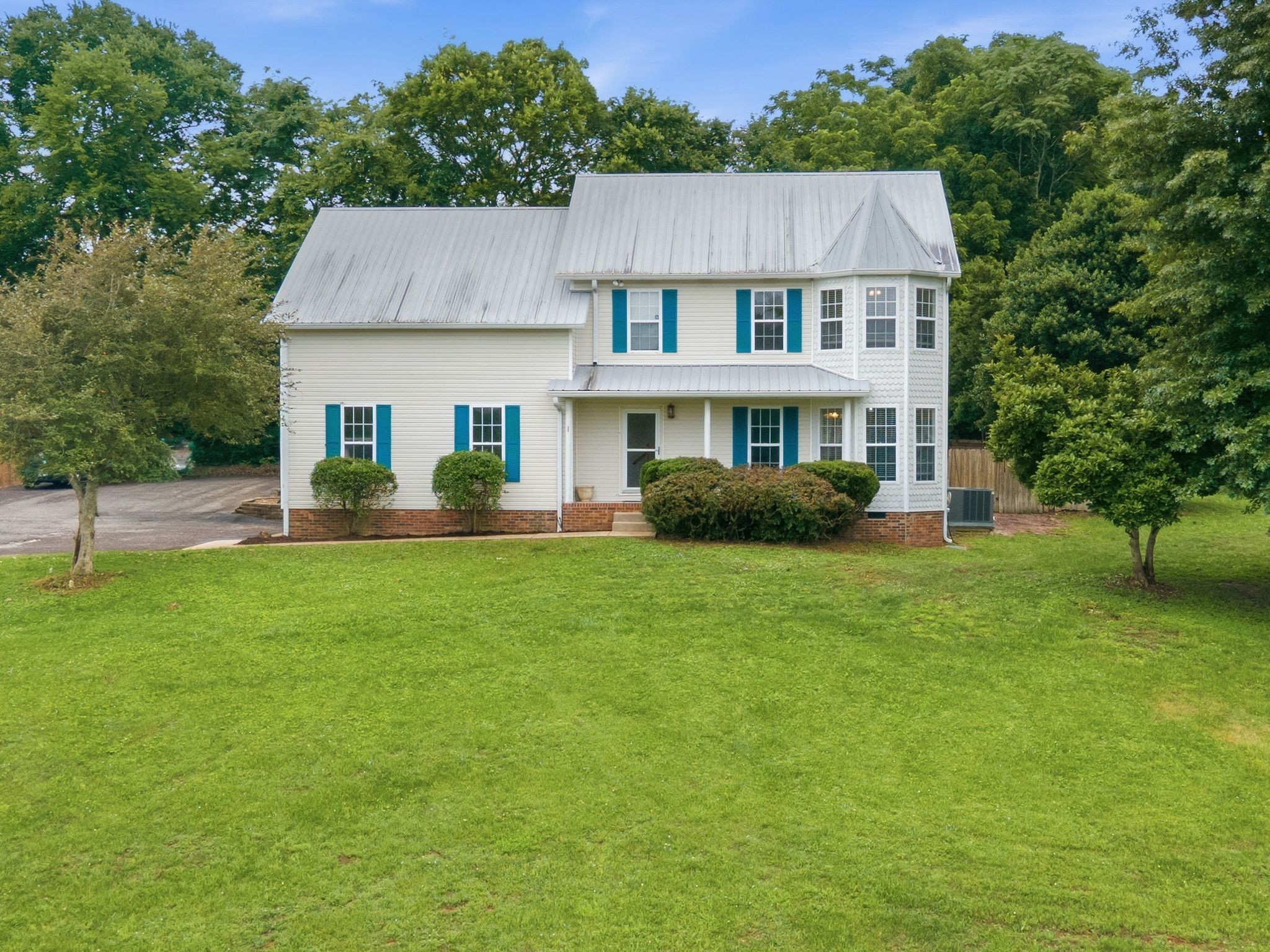 615 Vaughan's Gap Road Spring Hill, TN 37174 - Photo 3 of 26 a aerial view of a house next to a big yard and large trees