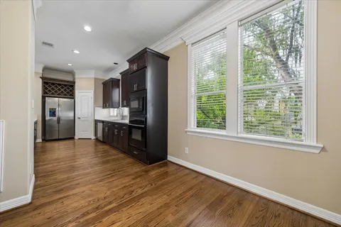 a kitchen with a table and chairs