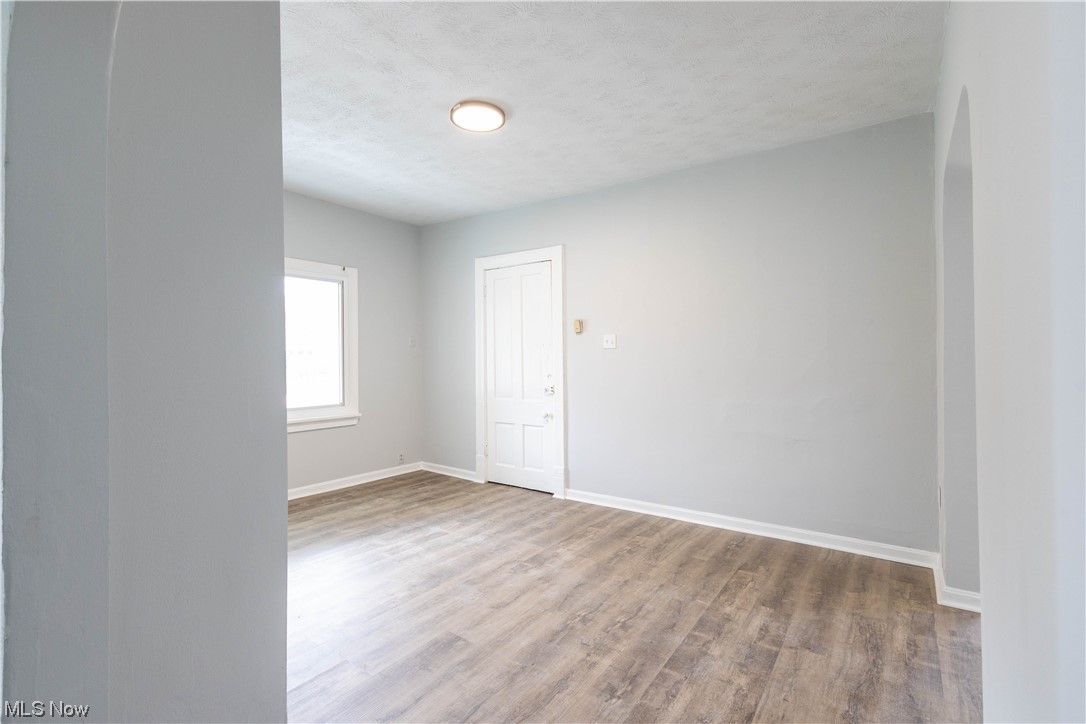 11838 Triskett Road Cleveland, OH 44111 - Photo 5 of 20 View of hardwood floored empty room