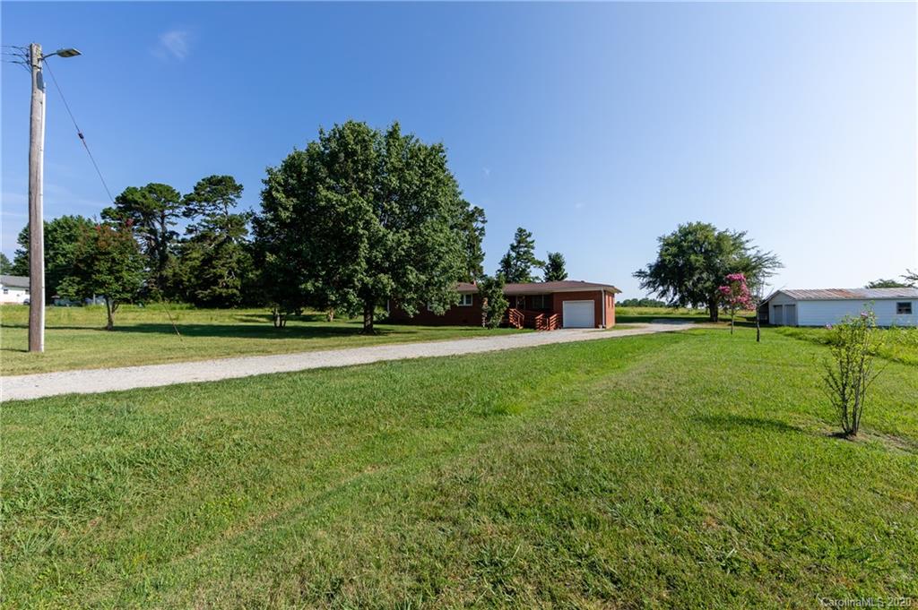 4480 Needmore Road Woodleaf, NC 27054 - Photo 1 of 15 a view of a garden with houses