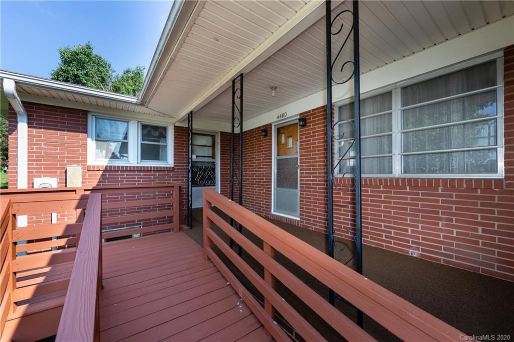 4480 Needmore Road Woodleaf, NC 27054 - Photo 4 of 15 a view of a balcony with wooden floor and fence