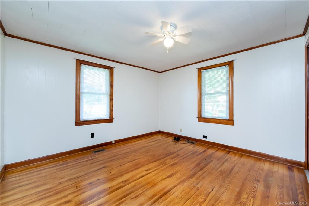 4480 Needmore Road Woodleaf, NC 27054 - Photo 5 of 15 wooden floor in an empty room with a window