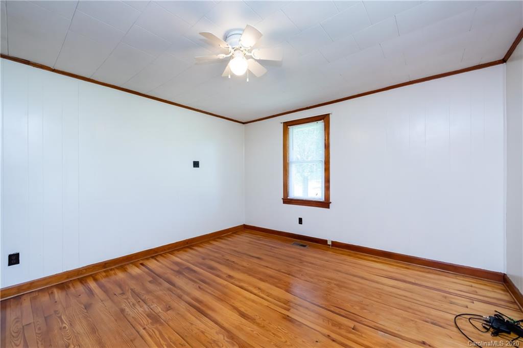 4480 Needmore Road Woodleaf, NC 27054 - Photo 7 of 15 wooden floor in an empty room with a window