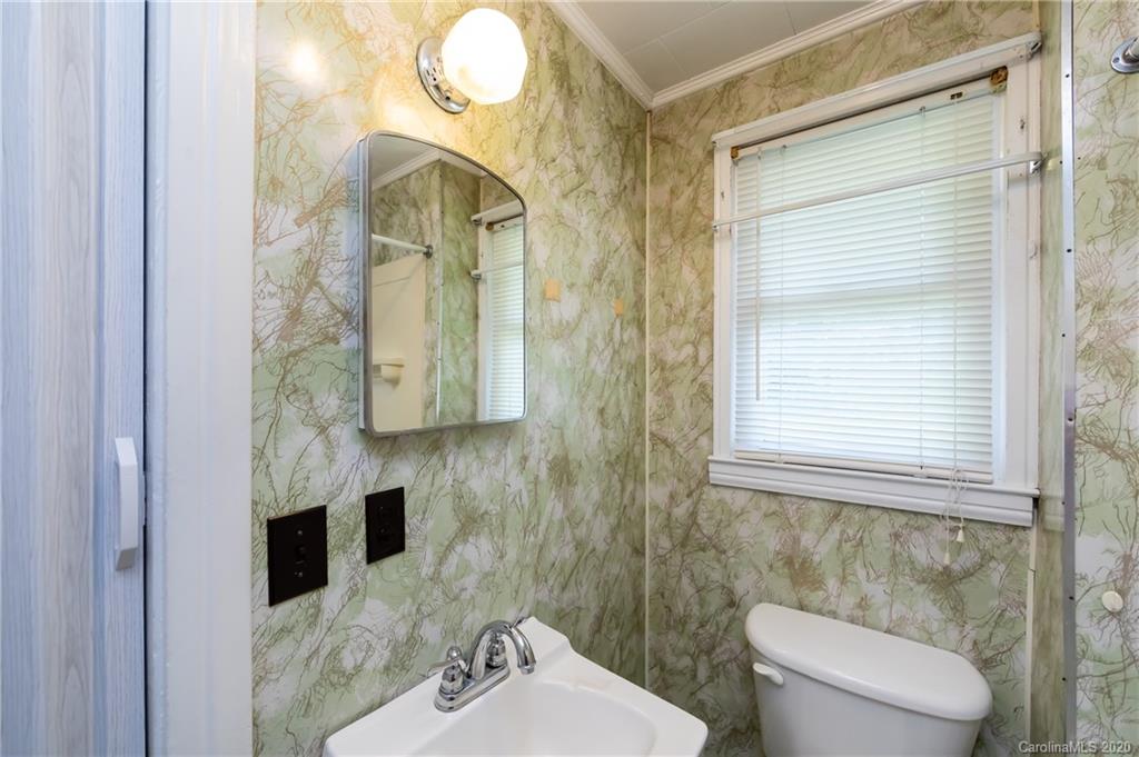 4480 Needmore Road Woodleaf, NC 27054 - Photo 8 of 15 a bathroom with a sink a toilet and shower