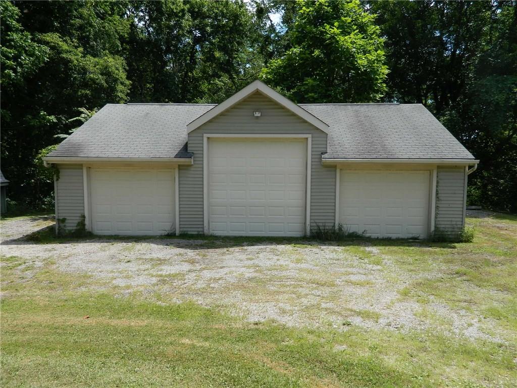 94 Trump Road Cheswick, PA 15024 - Photo 5 of 20 Huge three car garage. Center stall has concrete floor; other two have not been completed