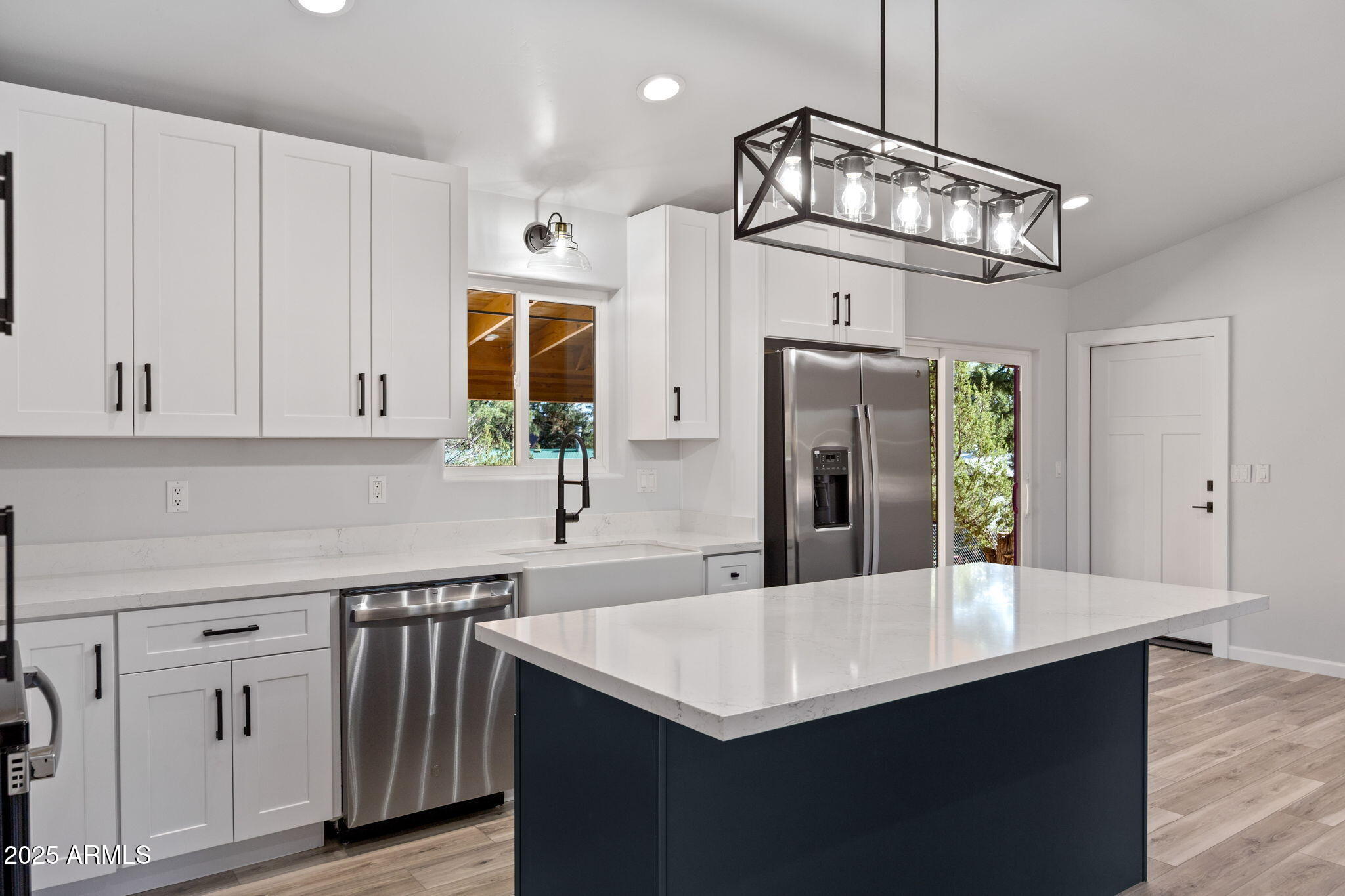 1982 Christmas Pine Road Overgaard, AZ 85933 - Photo 12 of 34 a kitchen with cabinets and wooden floor