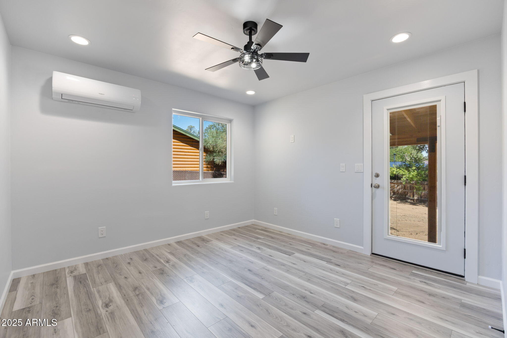 1982 Christmas Pine Road Overgaard, AZ 85933 - Photo 15 of 34 wooden floor in an empty room with a window