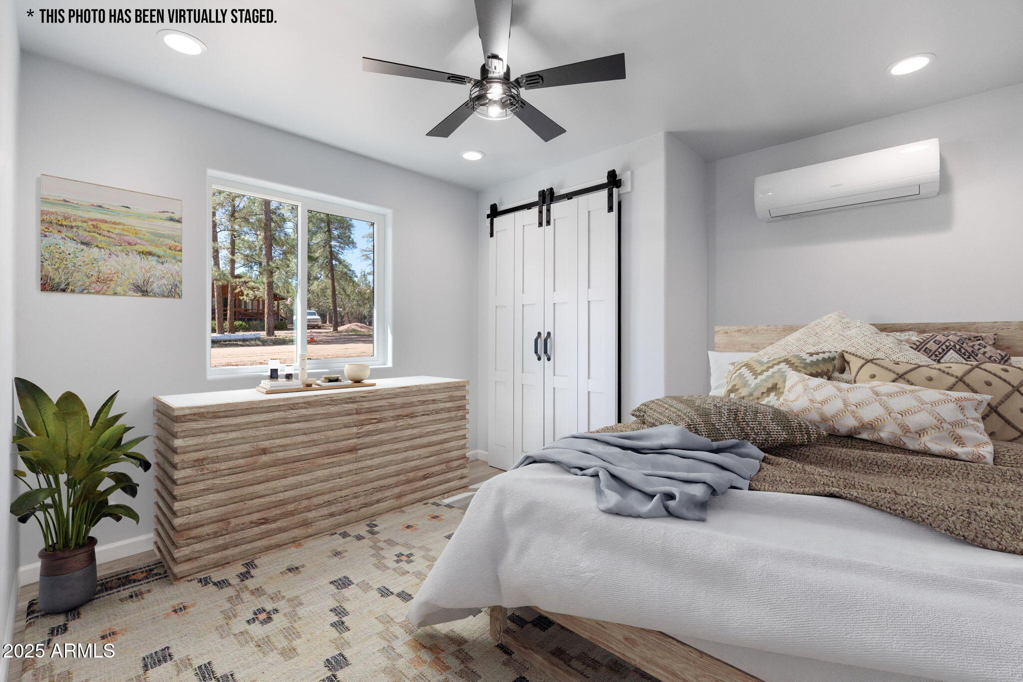 1982 Christmas Pine Road Overgaard, AZ 85933 - Photo 21 of 34 a bedroom with a bed and a potted plant