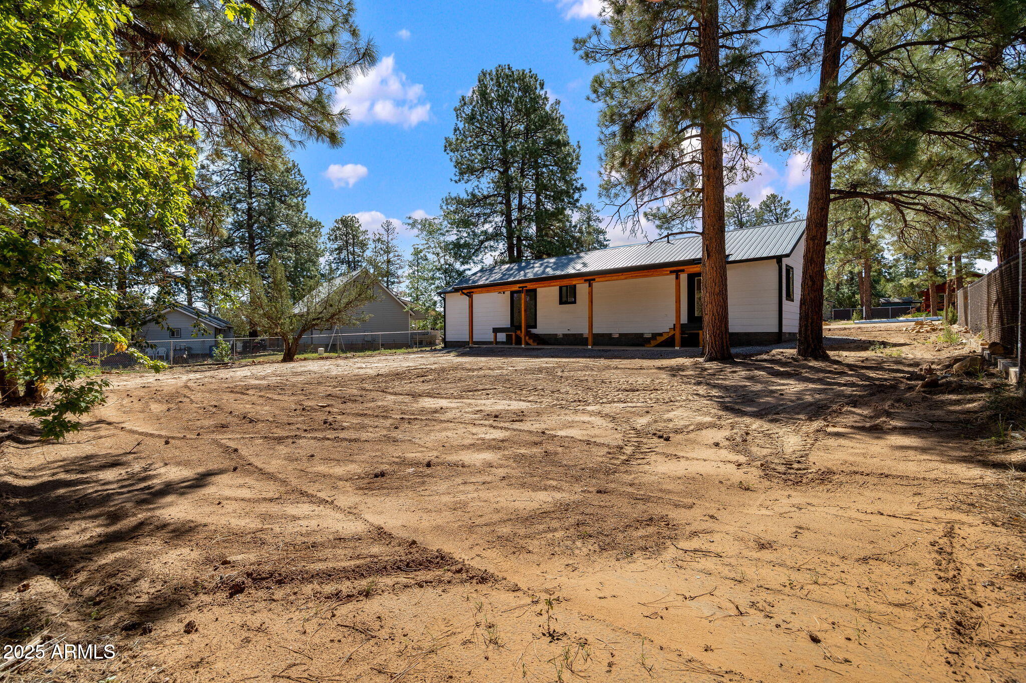 1982 Christmas Pine Road Overgaard, AZ 85933 - Photo 29 of 34 a view of a house with a yard