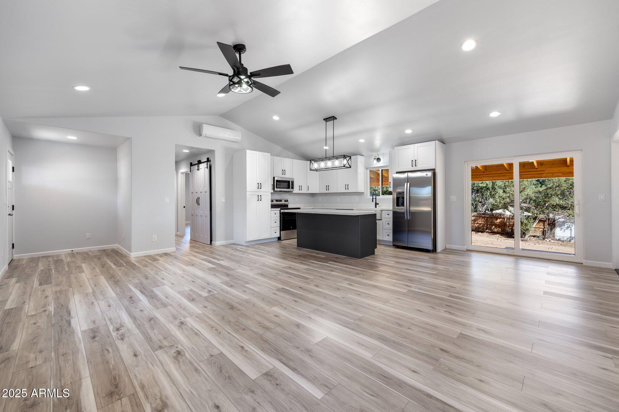1982 Christmas Pine Road Overgaard, AZ 85933 - Photo 7 of 34 a view of a kitchen with a sink and a refrigerator
