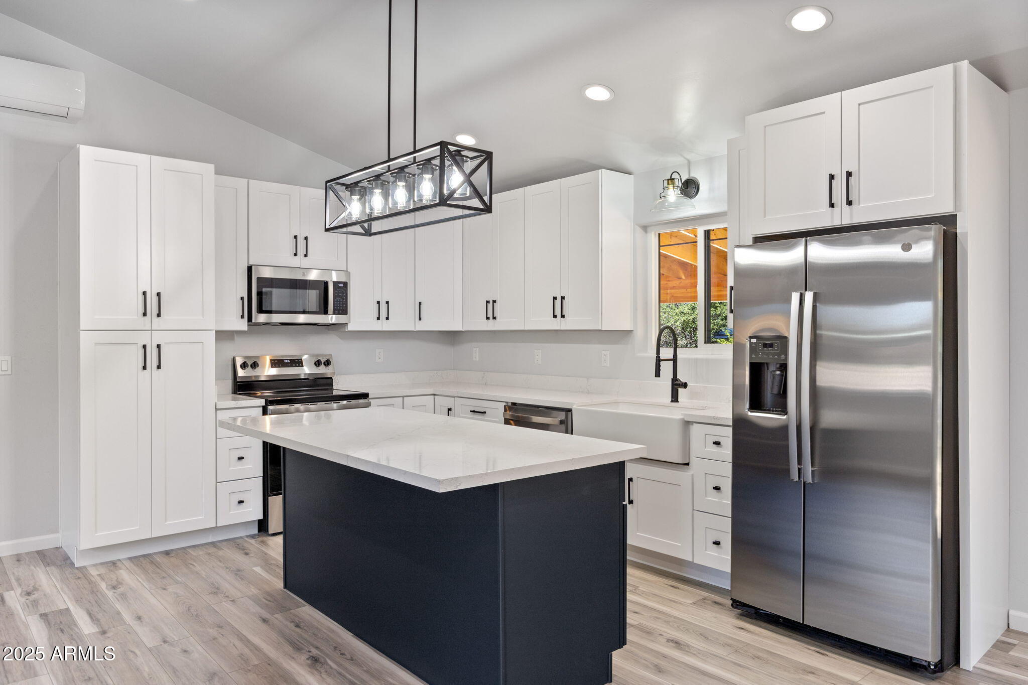 1982 Christmas Pine Road Overgaard, AZ 85933 - Photo 10 of 34 a kitchen with kitchen island granite countertop appliances cabinets a sink and a counter top space