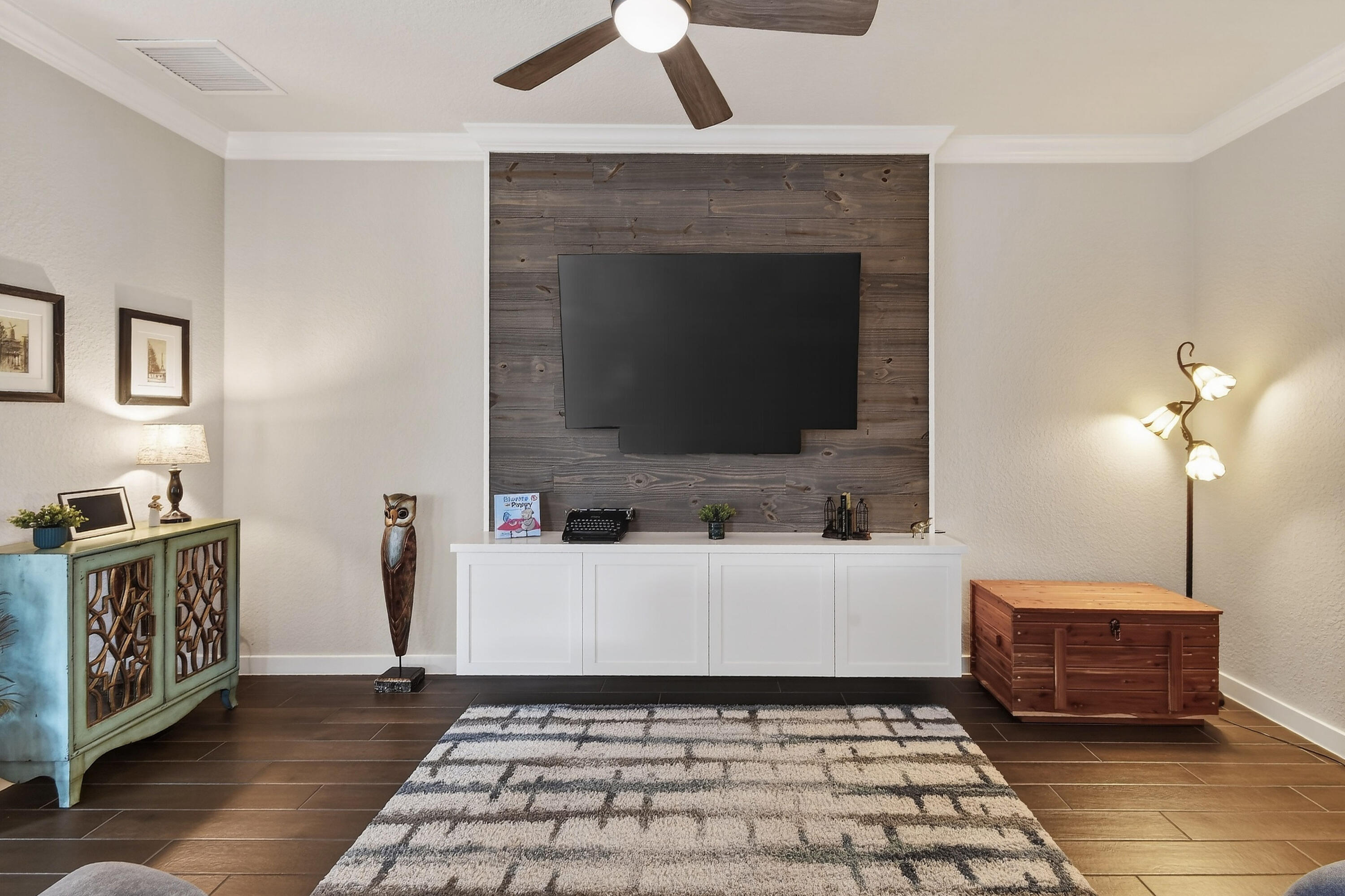 7561 Southwest Harbor Cove Drive Stuart, FL 34997 - Photo 15 of 62 a living room with a couch and a flat screen tv