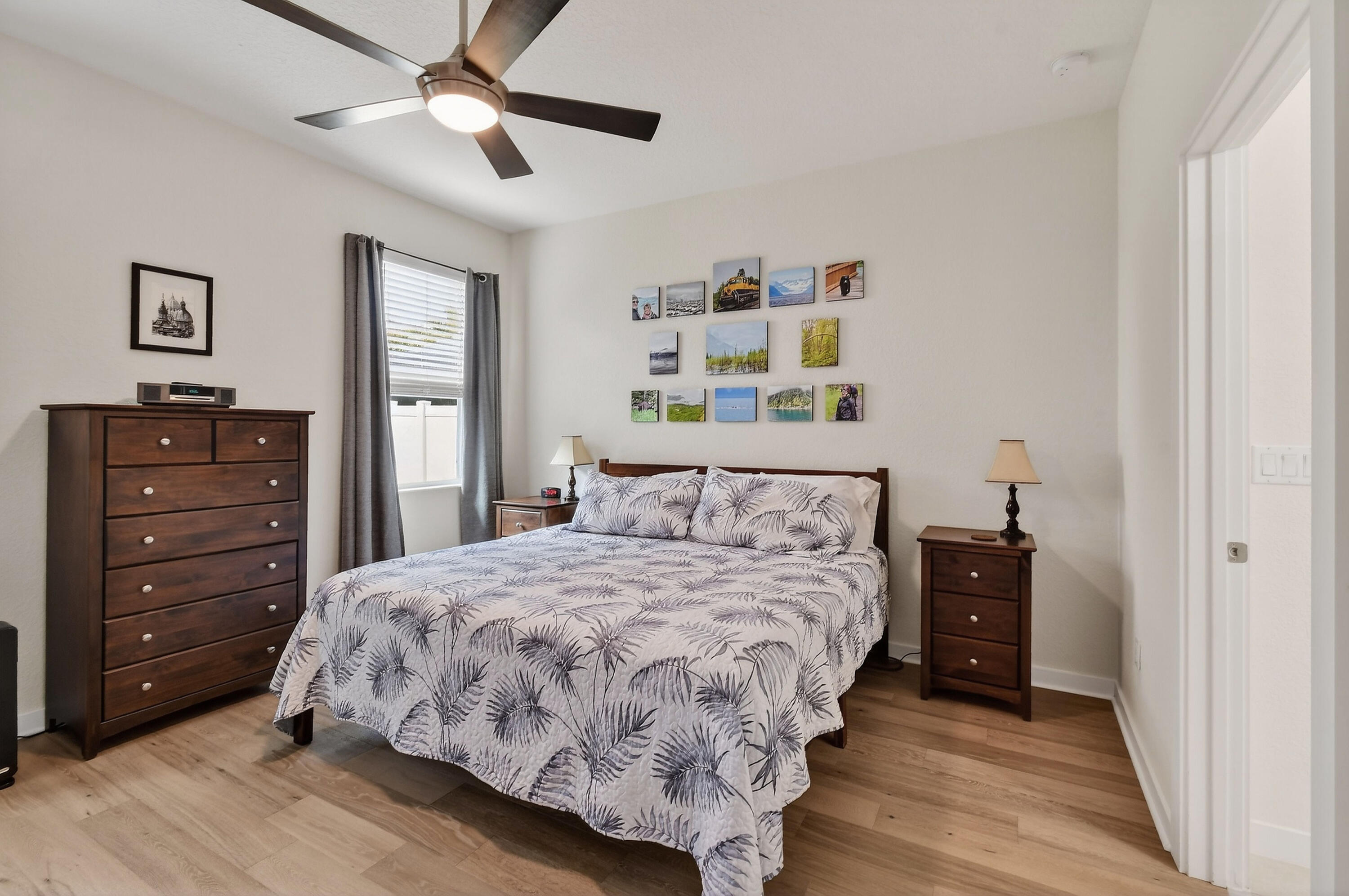 7561 Southwest Harbor Cove Drive Stuart, FL 34997 - Photo 31 of 62 a bedroom with a bed and a dresser