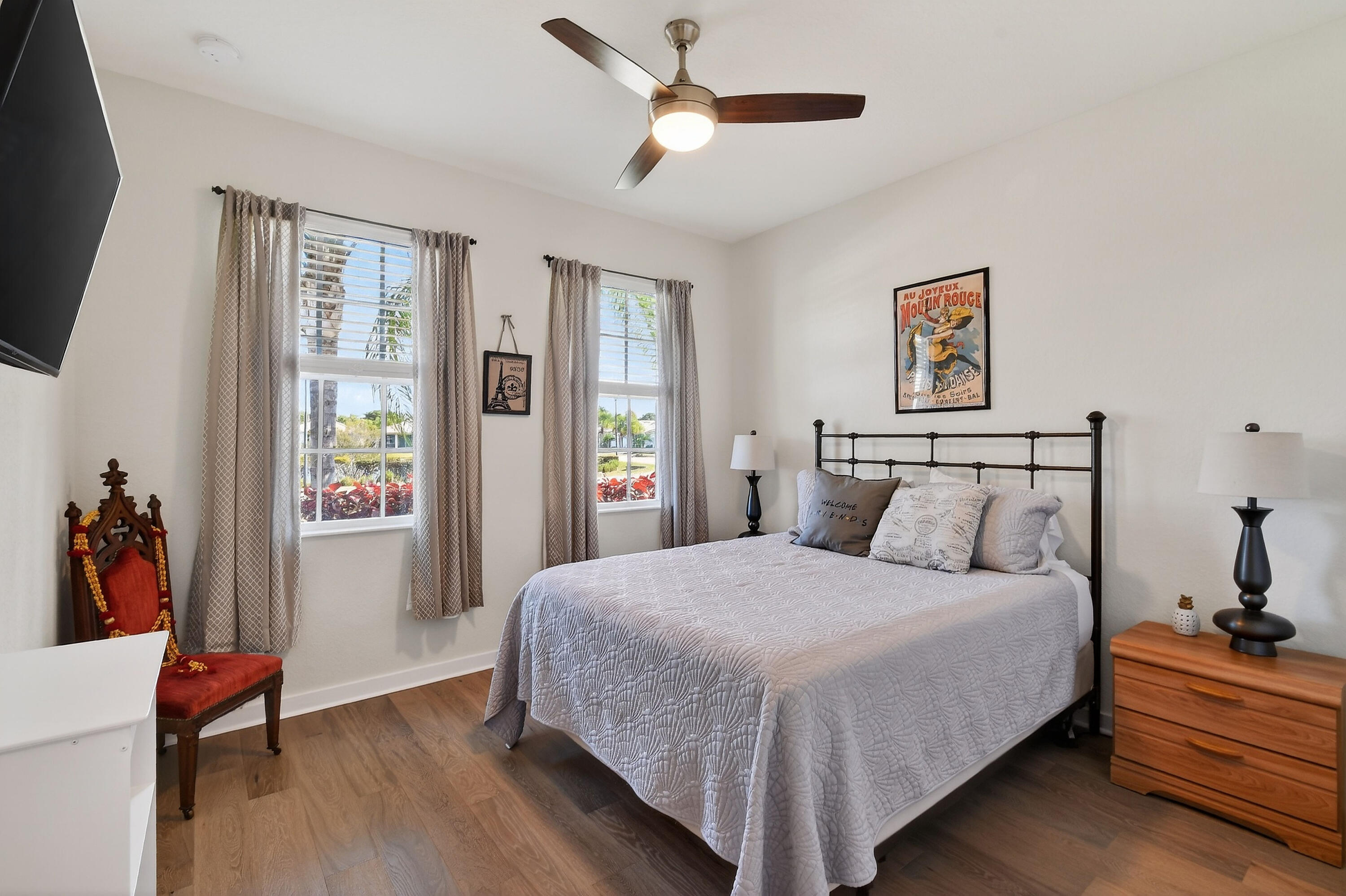 7561 Southwest Harbor Cove Drive Stuart, FL 34997 - Photo 40 of 62 a bedroom with a bed and wooden floor
