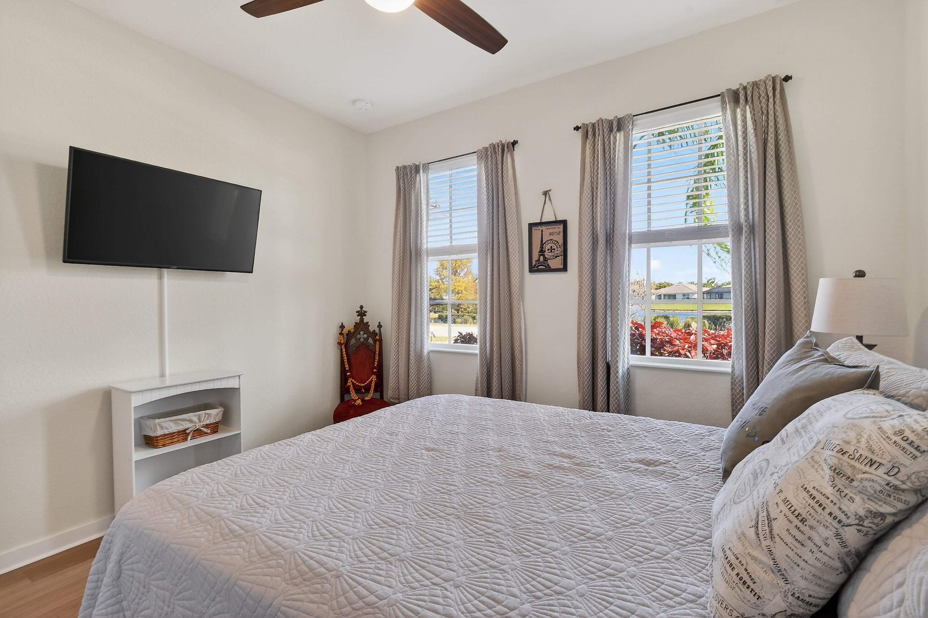 7561 Southwest Harbor Cove Drive Stuart, FL 34997 - Photo 41 of 62 a bedroom with a bed and a flat screen tv