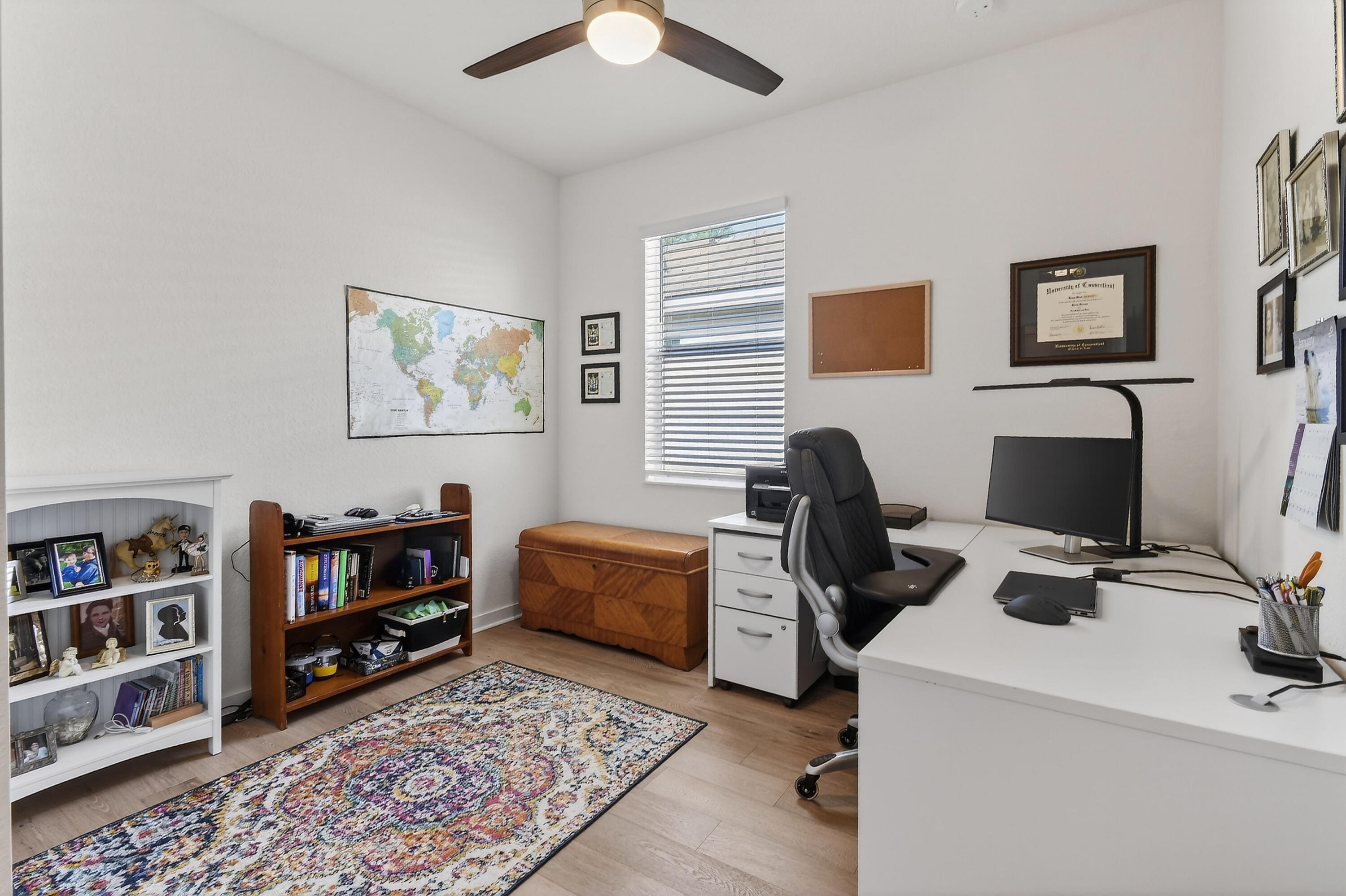 7561 Southwest Harbor Cove Drive Stuart, FL 34997 - Photo 45 of 62 a view of a workspace with furniture and a bookshelf