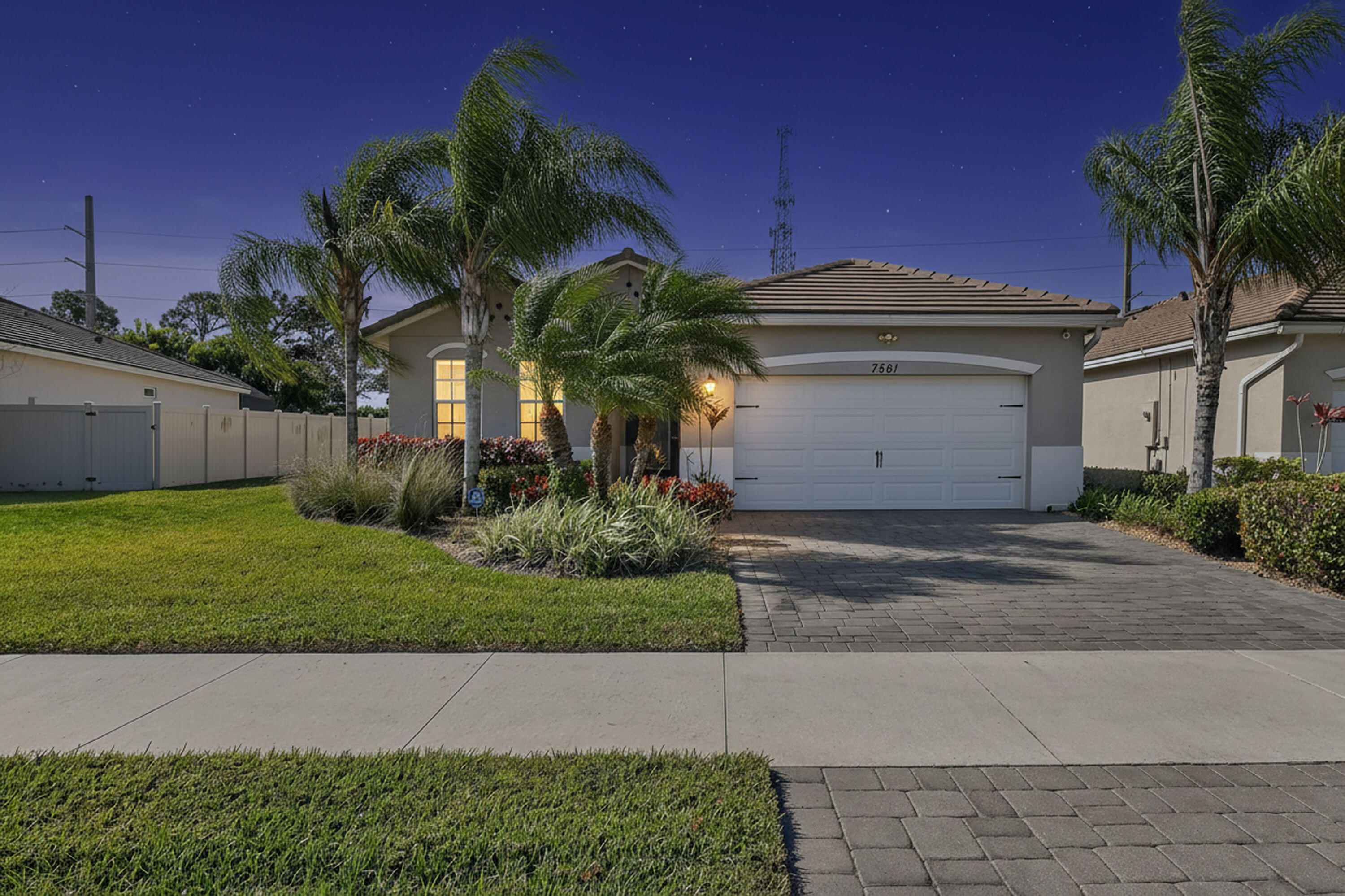 7561 Southwest Harbor Cove Drive Stuart, FL 34997 - Photo 5 of 62 a view of a house with a yard