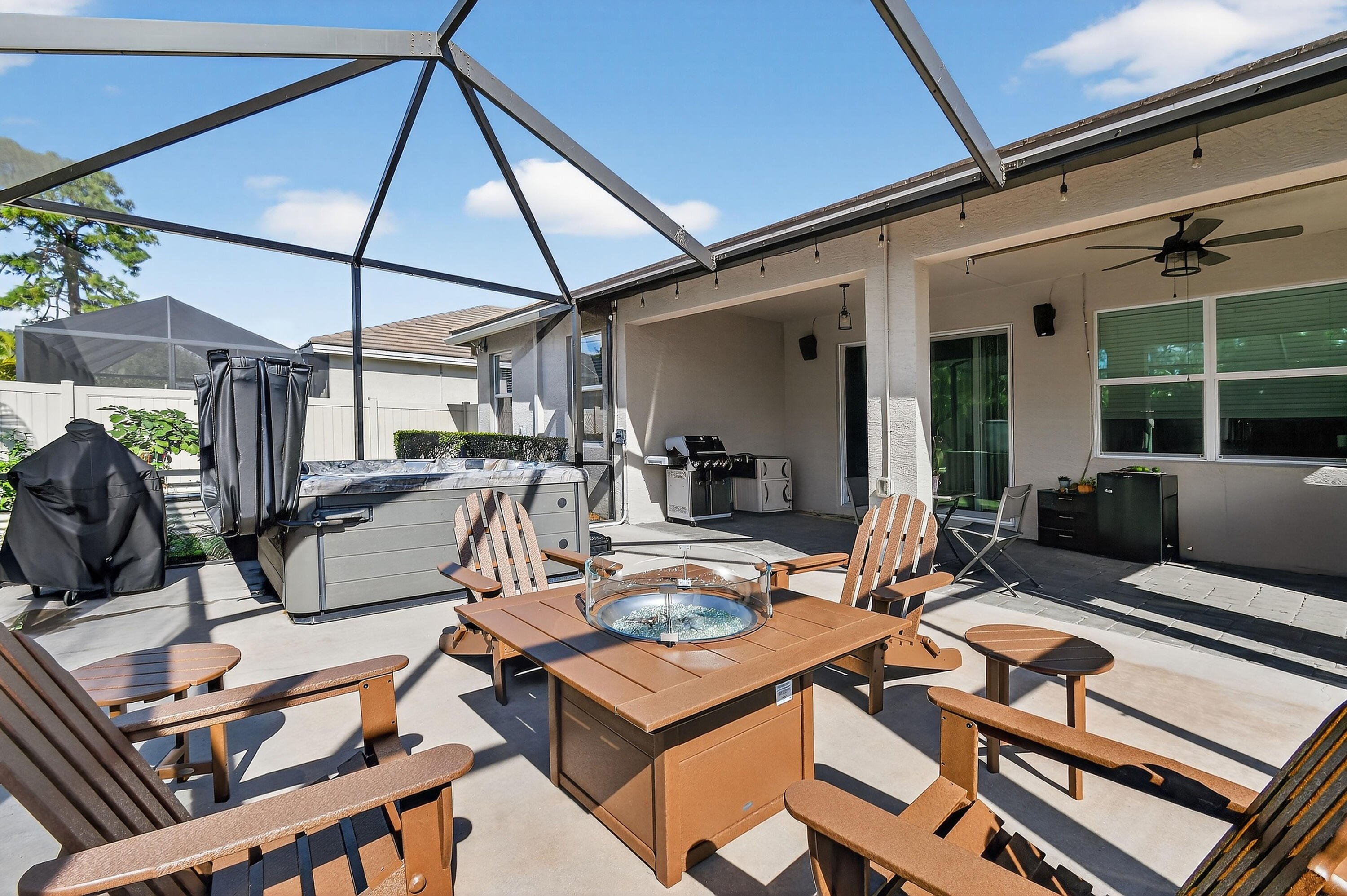 7561 Southwest Harbor Cove Drive Stuart, FL 34997 - Photo 55 of 62 a view of a patio with a dining table and chairs