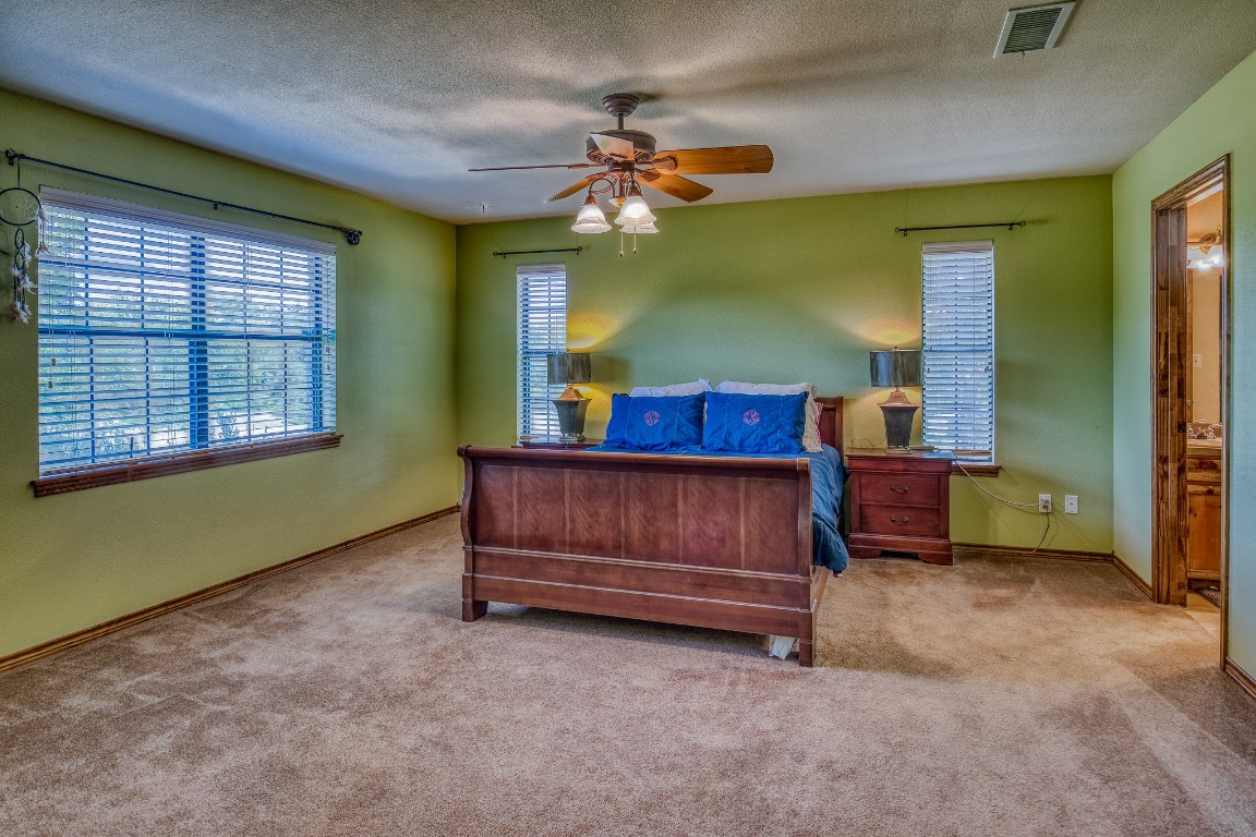 515 Highway 543 Loop West Point, TX 78963 - Photo 31 of 37 a bedroom with a bed and a window