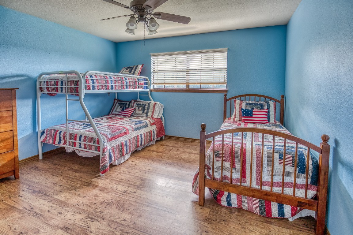 515 Highway 543 Loop West Point, TX 78963 - Photo 34 of 37 a bedroom with two beds and a baby crib