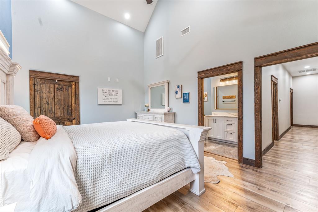 239 32507th Road Paris, TX 75460 - Photo 36 of 40 a bedroom with a bed and wooden floor