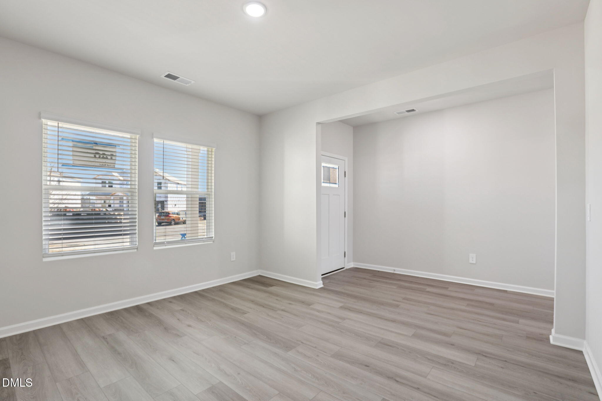 36 Hoff Court Angier, NC 27501 - Photo 10 of 43 a view of an empty room with wooden floor and a window