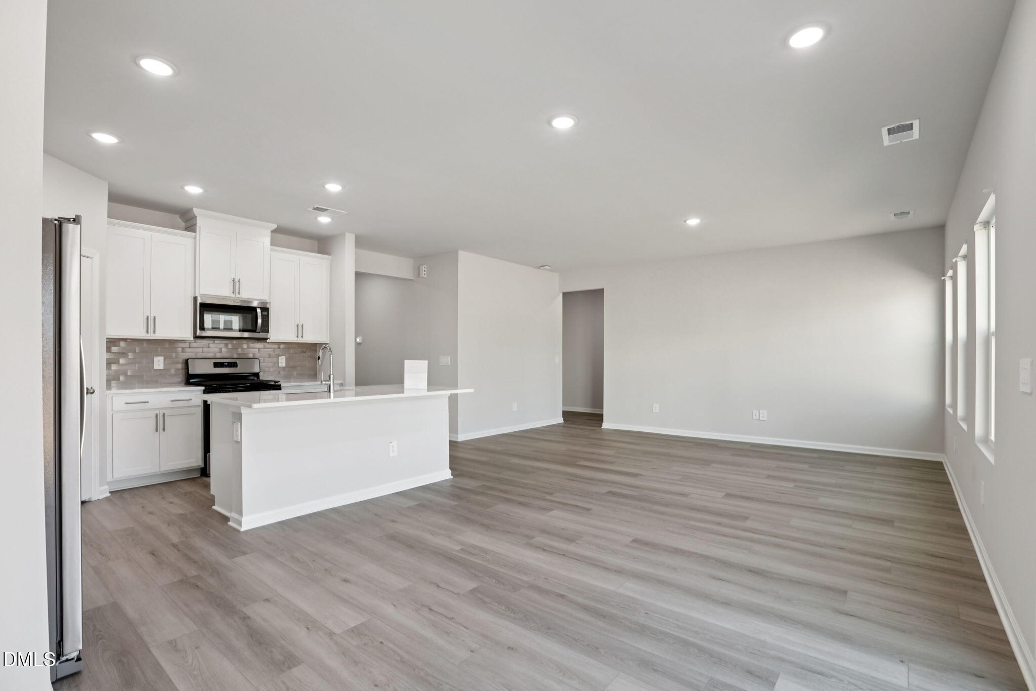 36 Hoff Court Angier, NC 27501 - Photo 13 of 43 a view of kitchen with granite countertop cabinets and refrigerator
